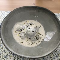 raw portobello-shitake ravioli with cashew-black garlic cream  at Makalu Veggie in Alicante