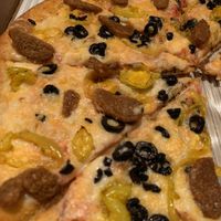Vegan cheese, vegan sausage, b. peps, and blk olives. Dang at Pizzeria 1081 & Bakery in Akron