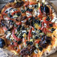 Veggie pizza with vegan cheese at Scoozi in Picton