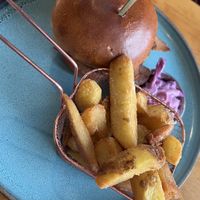 Vegan burger with chunky chips and slaw  at The Drift Inn in Isle Of Arran