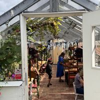 Sitting area in the greenhouse   at Slottsträdgårdens Kafé in Malmo