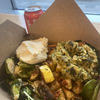 Build your own bowl - daal, grains, greens, roasted sprouts & zucchini, hummus and sweet potatoes. Enough left overs for dinner 😛  at Whole Foods Market - Stonewall St in Charlotte
