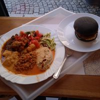 chickpea burger and several types of delicious curry with veggies and hummus at Satsanga in Sofia