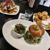 Disco fries, fiery chick’n sandwich, garlic butter parmasean wings   at Life on Mars in Seattle