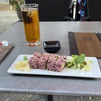 Inside out sushi with pink rice, tempeh and mango and some apple juice  at Tiger Club Vegan Sushi in Berlin