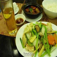 veges and 'seafood' on rice cakes, braised 'pork', and lotus tea. at Sen Vegan House in Ho Chi Minh City