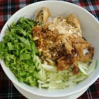 noodles with spring rolls & mock meat in a bowl. at Sen Vegan House in Ho Chi Minh City