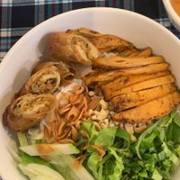 Noodle dish with fake chicken and spring rolls  at Sen Vegan House in Ho Chi Minh City
