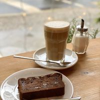 Banana bread and coffee with oat milk at Miros Cafe in Berlin