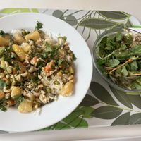 Chickpea curry with potatoes, carrots, & peas. served with lime rice, cashews, coriander, and wild herb salad. Vegan (Tuesday and Friday lunch)  at Flamingo Fresh Food Bar in Berlin