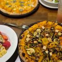 Fruity salad and vegan sourdough pizza. at The Old House  in Karnataka