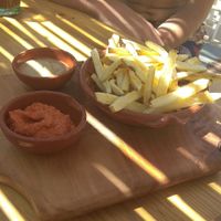 The chips that come with the wrap. Iogurt sauce (not vegan) and home made ketchup. at Cato in Carrapateira