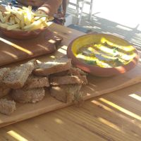 Hummus with dark bread. at Cato in Carrapateira