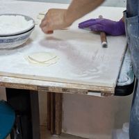 Dumpling skins being prepared. at Lái Xīn SùShí 來欣素食手工水餃 in Taipei