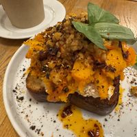 Brioche, smoked hummus, pumpkin, tempeh, chili oil, thai basil, cilantro, furikake  at BarStudio in Warsaw