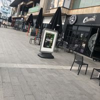 Vegan sign exterior and outside seating  at Creams Cafe in Chatham