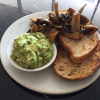 Toast with smashed avocado and mushrooms  at Wollemi in Canberra
