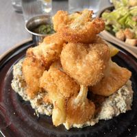 Cauliflower with Artichoke dip. César Salad in the back  at Don Vegan in Quebec