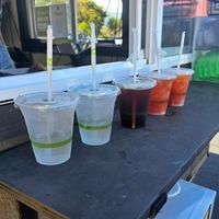 Water, iced coffee, coco h20 with strawberry fizz added at Maui Ono Donuts in Kihei
