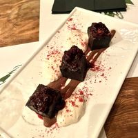 Chocolate fudge brownie with wildberry sauce and cream - dessert.  at Pandora Greenbox in Split