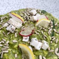 Vegan risotto with vegan feta, vinegar bubbles, seeds, radish and lemons.  at Pandora Greenbox in Split