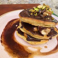 Chocolate banana pistachio and peanut butter vegan pancakes. Vegan sliders with beetroot buns. Mimosas with decorative dried flowers.  at Pandora Greenbox in Split