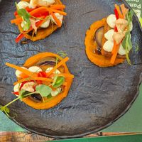 Crispy tempeh: polenta crust, eggplant, carrot-miso puree, wasabi aioli. at Pandora Greenbox in Split