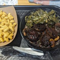 $10 Mac and cheese (do not recommend) and $15 lunch plate (oxtail, rice and peas, collard greens) at BAD Gyal Vegan in Marietta