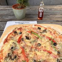 Pizza MEDITERRÂNEA with vegan cheese  at TerraPlana Café in Porto