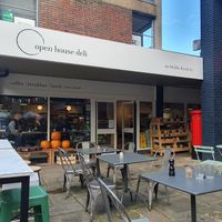 Outdoor seating and seasonal produce at Open House Deli in Winchester