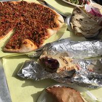 Impossible plate, olive saj bread, falafel wrap and more   at Furn Saj Restaurant & Bakery in Granada Hills