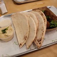 Falafel, bread, hummus, and tahini sauce at Umi Falafel - North City in Dublin