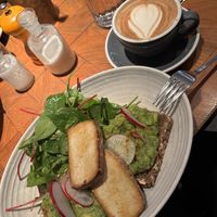 Avocado toast and tofu with an oat milk cappuccino   at ERICH in Vienna