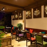 offering jewels pictures are respectedly hung on the old French-style wall at Shamballa Vegetarian Restaurant & Tea House in Ho Chi Minh City