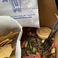 Lentil burger salad with chips and a mango iced tea. Great to find some vegan options in Helena ! at Benny's Bistro in Helena