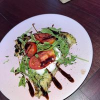 Yummy vegan chickpea slice :)) with vegan cheese, rocket and tomato. So yum!   at Life's a Peach in Utrecht