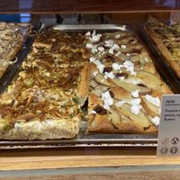 The focaccia on the left side of the middle is with fungi shawarma. It’s tasty and has only a subtle shawarma flavour.  at Life's a Peach in Utrecht