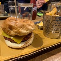 Plant-based burger with fries on side. at The Wheatsheaf in Loughborough