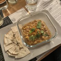 African peanut chickpea stew with coriander and dried apricot  at Vas Manci in Budapest