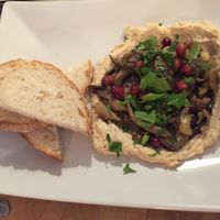 Middle eastern eggplant, pomegranate and hummus with soudough (vegan) at Vas Manci in Budapest