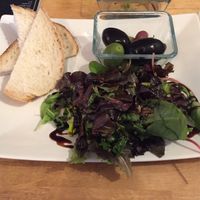 Green salad, olives and sourdough (vegan) at Vas Manci in Budapest