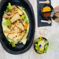 Grilled Tofu on Mashed Potatoes, flavored salt and chili oil, and small saladd  at MUYU in Puerto Baquerizo Moreno
