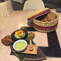 Sourdough bread with avocado spread and lemongrass oil at MUYU in Puerto Baquerizo Moreno