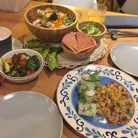 Lemongrass and coconut fried rice and a mixed-greens salad with sauteed veggies in a basil dressing at MUYU in Puerto Baquerizo Moreno
