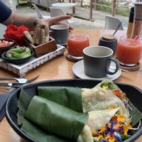 Vegan breakfast wrap in front and toast with avocado in the back. Great coffee too at MUYU in Puerto Baquerizo Moreno