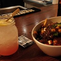 Watermelon cocktail and poutine at Bowhead Pub in Montreal