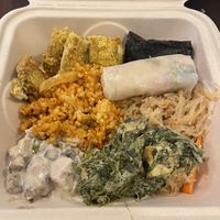 Palak paneer, tofu chick’n, summer roll, kimchi rice, and vegetable korma  at Down to Earth - Store and Deli in Honolulu