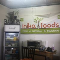 Logo and fridge at Inika Foods in Wilton Manors