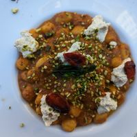Gnocchi with tomato pesto, pistachios and vegan ricotta at Cavo Bistrot in Cagliari