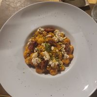 Gnocchi with red pesto, pistachio, almonds, vegan ricotta and half-dried tomatoes at Cavo Bistrot in Cagliari